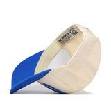 The BYU Cougars Stride Hat by No Rivals features a cream crown and blue brim, with the snapback turned inside out to reveal the interior label and detailed stitching. Embroidered logos provide a stylish accent, making this hat a standout choice for your next gameday look.