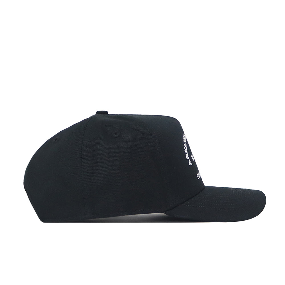 The Arkansas Outlaw Hat - Black by No Rivals is a durable black baseball cap, shown from the side, with a curved brim and an adjustable snap back closure for the ideal gameday fit. An embroidered logo with partially visible white text decorates the front panel.