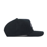 The Arkansas Outlaw Hat - Black by No Rivals is a durable black baseball cap, shown from the side, with a curved brim and an adjustable snap back closure for the ideal gameday fit. An embroidered logo with partially visible white text decorates the front panel.