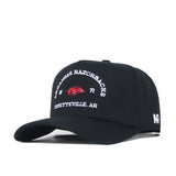 Introducing the Arkansas Outlaw Hat - Black by No Rivals: This black baseball cap features an embroidered logo with “Arkansas Razorbacks, 1871, Fayetteville, AR” alongside a bold red hog on the front. The side of the cap displays the “NR” initials for No Rivals. Designed for a flawless gameday fit, it comes with a snap back closure that ensures all-day comfort.