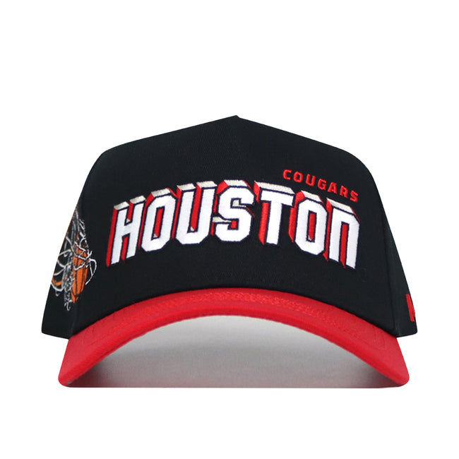 The Houston Courtside Hat is a black and red snapback featuring bold white and red HOUSTON text with COUGARS above, a partial basketball net graphic on the left side, and a structured fit made from high quality cotton.