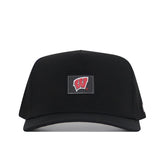 The Wisconsin Badgers Trainer Hat by No Rivals is a black baseball cap with a structured fit, featuring a rectangular front patch that displays a red W logo outlined in white, and is crafted from comfortable cotton material.