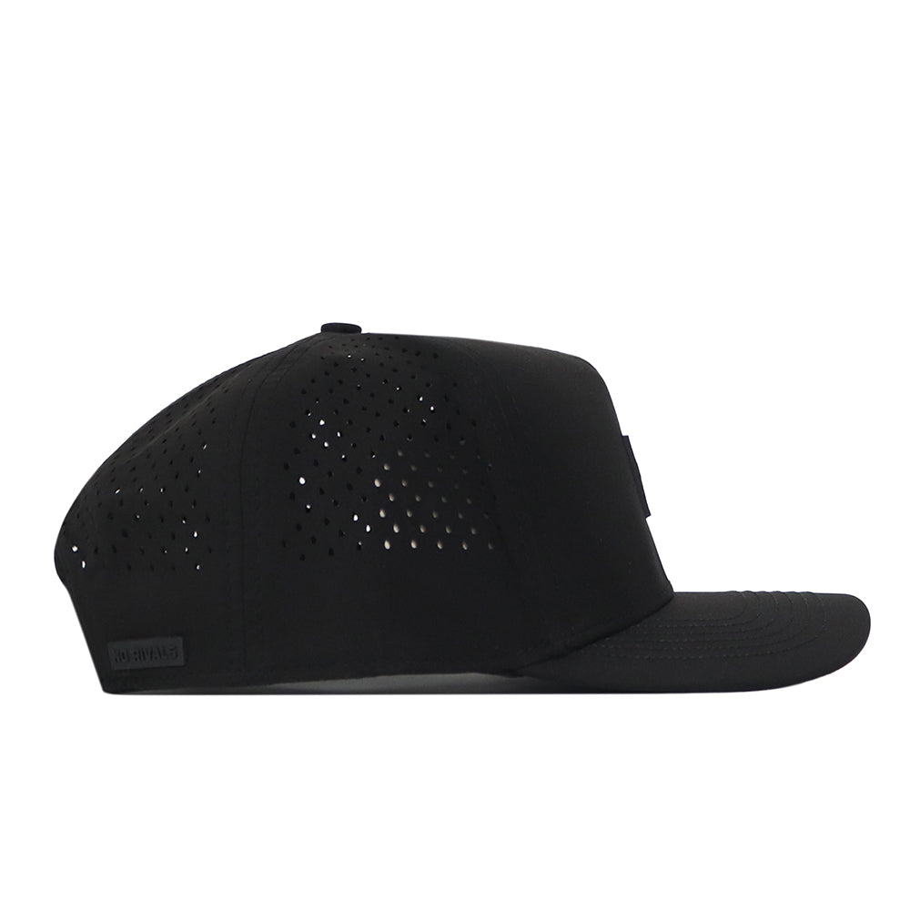 The Wisconsin Badgers Trainer Hat by No Rivals is a black baseball cap with a flat brim, shown from the side. It features a structured fit and small perforated holes for ventilation on the side panels, crafted from durable cotton material.