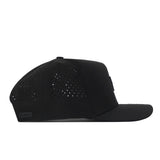 The Wisconsin Badgers Trainer Hat by No Rivals is a black baseball cap with a flat brim, shown from the side. It features a structured fit and small perforated holes for ventilation on the side panels, crafted from durable cotton material.