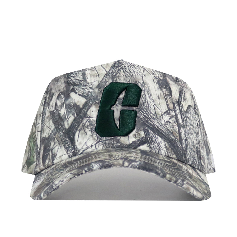 The Charlotte Outland Hat by No Rivals is a camouflage baseball cap featuring a prominent green embroidered C logo on the front and an adjustable snap back for the perfect gameday fit.