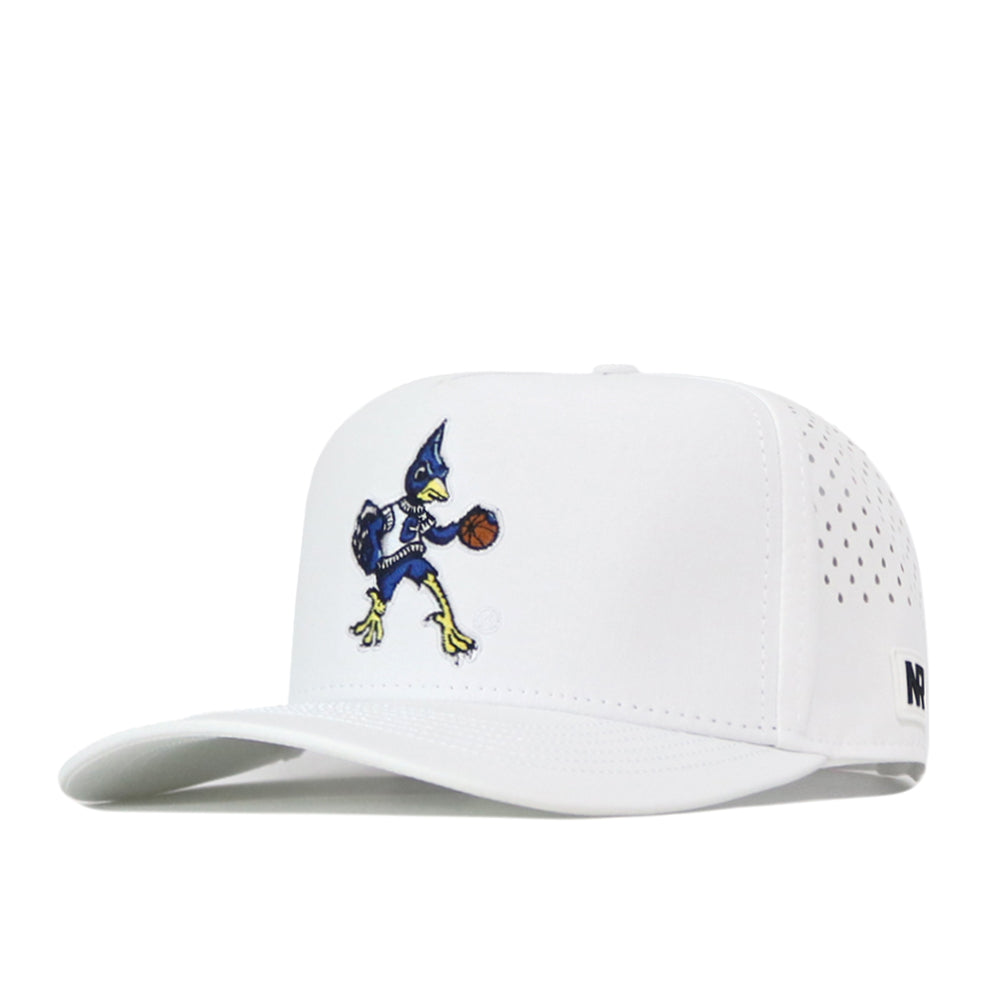 The No Rivals Creighton Bluejays Basketball Hat in white is a snapback cap crafted from performance fabric for lasting comfort. It features an embroidered cartoon Bluejays mascot dribbling a basketball, small side ventilation holes, and an officially licensed black logo near the brim.