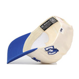 The Upside Down JAYS Hat - Creighton by No Rivals is shown upside down, featuring a wolf logo on the front, blue visor, structured fit, and an Officially Licensed NO RIVALS label plus QR code inside the brim.