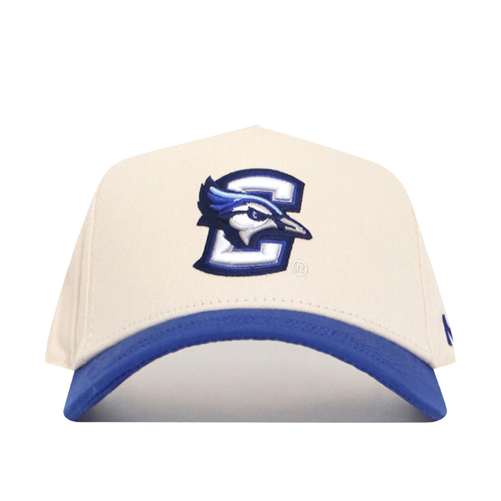 The No Rivals Creighton Logo Patch Hat is a white and blue snapback featuring a bold 3D-embroidered blue jay head inside a large C on the front plus a blue visor, all in a stylish cotton blend.