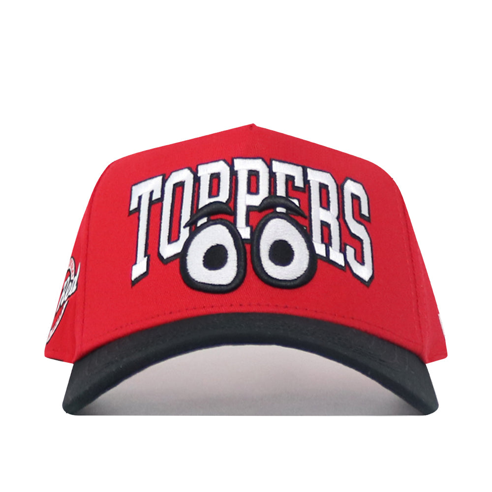 The No Rivals WKU Toppers Big Red Eyes Hat is a red snapback with bold white "TOPPERS" lettering above cartoon eyes, a black curved brim, and high-quality cotton for a comfortable, structured fit.