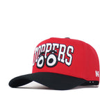 The No Rivals WKU Toppers Big Red Eyes Hat is a red snapback with a black brim, bold white "TOPPERS" text, and cartoon wide eyes embroidered below, offering a structured fit made from premium cotton.