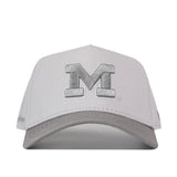 Elevate your gameday style with the Michigan Wolverines Graphite Hat from No Rivals—a light gray cap featuring a large, bold, embroidered letter M on the front panel, displayed against a crisp white background.