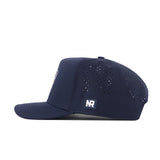 The No Rivals ETSU Golfing Buc Hat in navy features a snapback design, flat brim, side ventilation holes, and a small rectangular NR logo patch on the side.