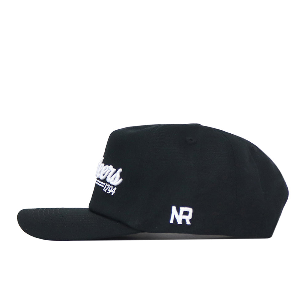 A black Tennessee Volunteers Script Hat by No Rivals features an embroidered logo with crisp white text on the front and the initials “NR” on the side. This officially licensed cap is displayed in a side profile view against a clean white background.