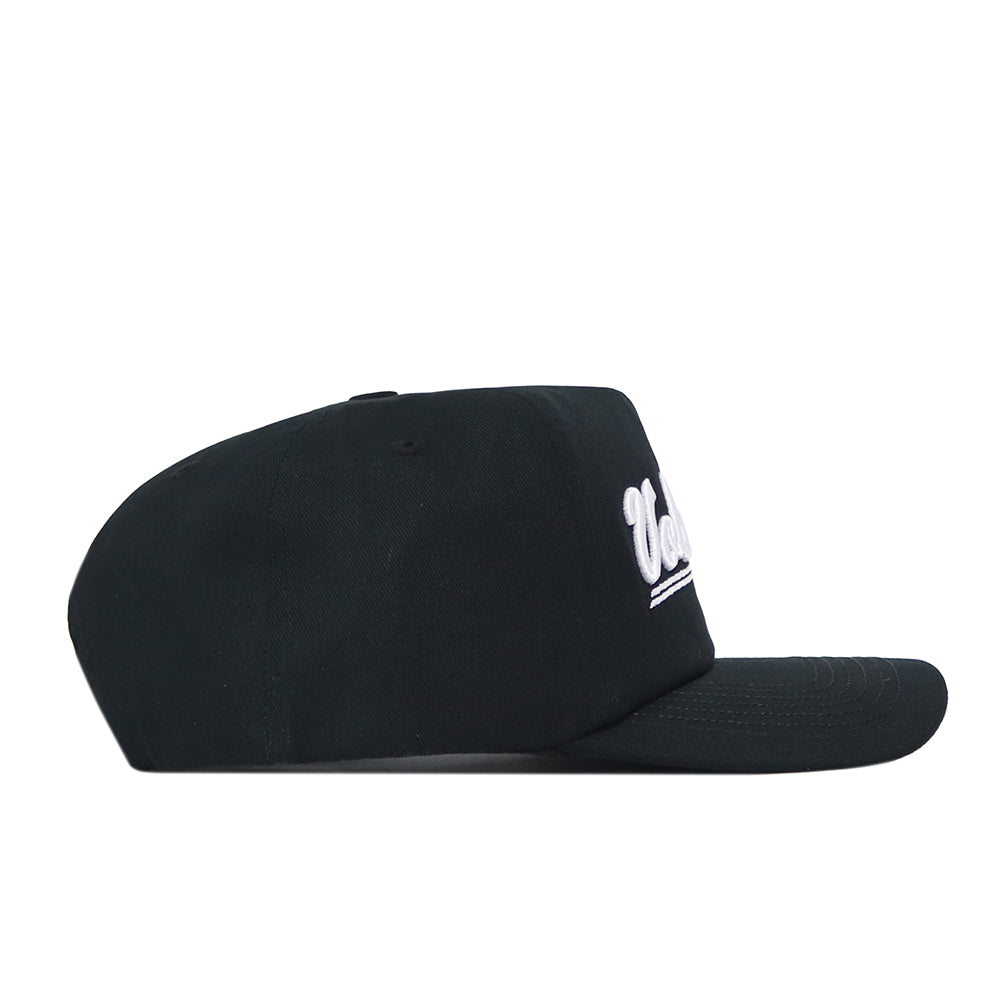 A side-profile view of the No Rivals Tennessee Volunteers Script Hat showcases its flat, straight brim and black snapback design, with the officially licensed white embroidered logo partially visible on the front.
