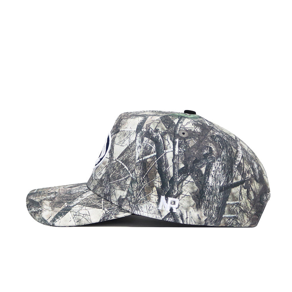A side view of the No Rivals Penn State Outland Hat, a structured fit cap with green, brown, and gray camouflage in high quality cotton, featuring a white embroidered AP logo on the side.
