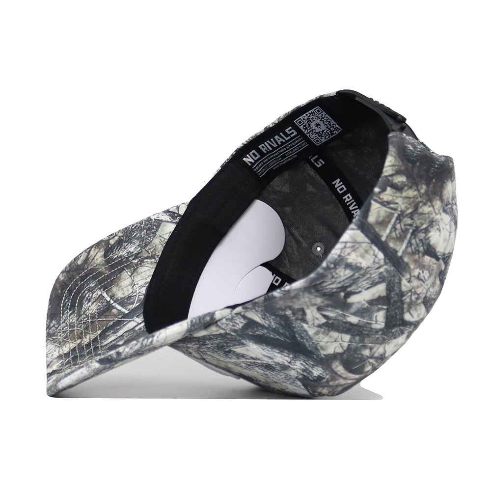 The Penn State Outland Hat by No Rivals is shown upside down on a white background, revealing its camouflage pattern, interior label, black sweatband, and a white crown insert. Made from high-quality cotton.