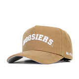 The Indiana Rustic Hat by No Rivals is a tan cotton canvas hat with "HOOSIERS" embroidered in white on the front and "NO RIVAL" stitched on the side of the brim, offering a structured fit for lasting comfort.