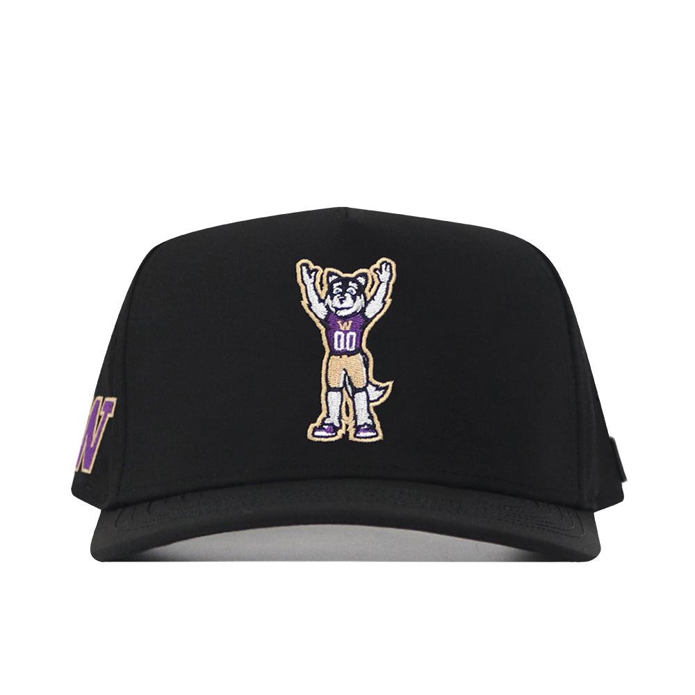 The Washington Huskies Football Mascot Hat - Black by No Rivals is a black baseball cap with an embroidered cartoon dog mascot in a sports jersey numbered 00 and raising its arms on the front center. Made from performance fabric, it includes an adjustable snap back for a comfortable fit.