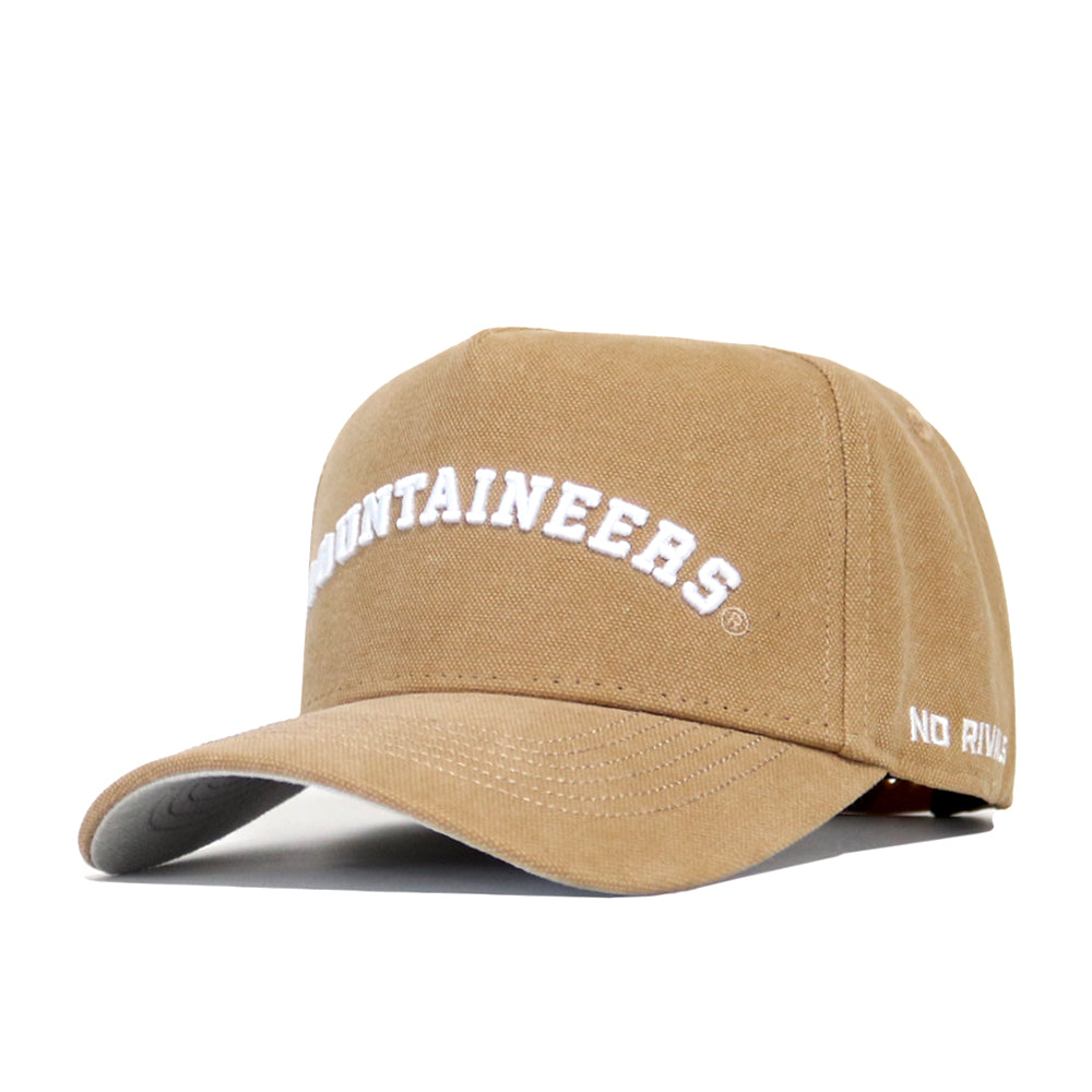 The West Virginia Rustic Hat by No Rivals is a tan cotton canvas cap with "MOUNTAINEERS" embroidered in white on the front and "NO RIV." on the side. It has an adjustable fit, a curved brim, and structured panels for a classic style.