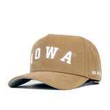 The Iowa Rustic Hat by No Rivals features brown cotton canvas, white text, and a snap back closure.