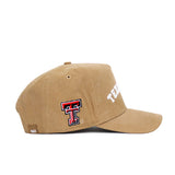 The Texas Tech Rustic Hat by No Rivals is a tan cotton canvas snapback with a structured fit, featuring "TEXAS" in white text on the front and the Texas Tech double T logo embroidered in red, black, and white on the side.