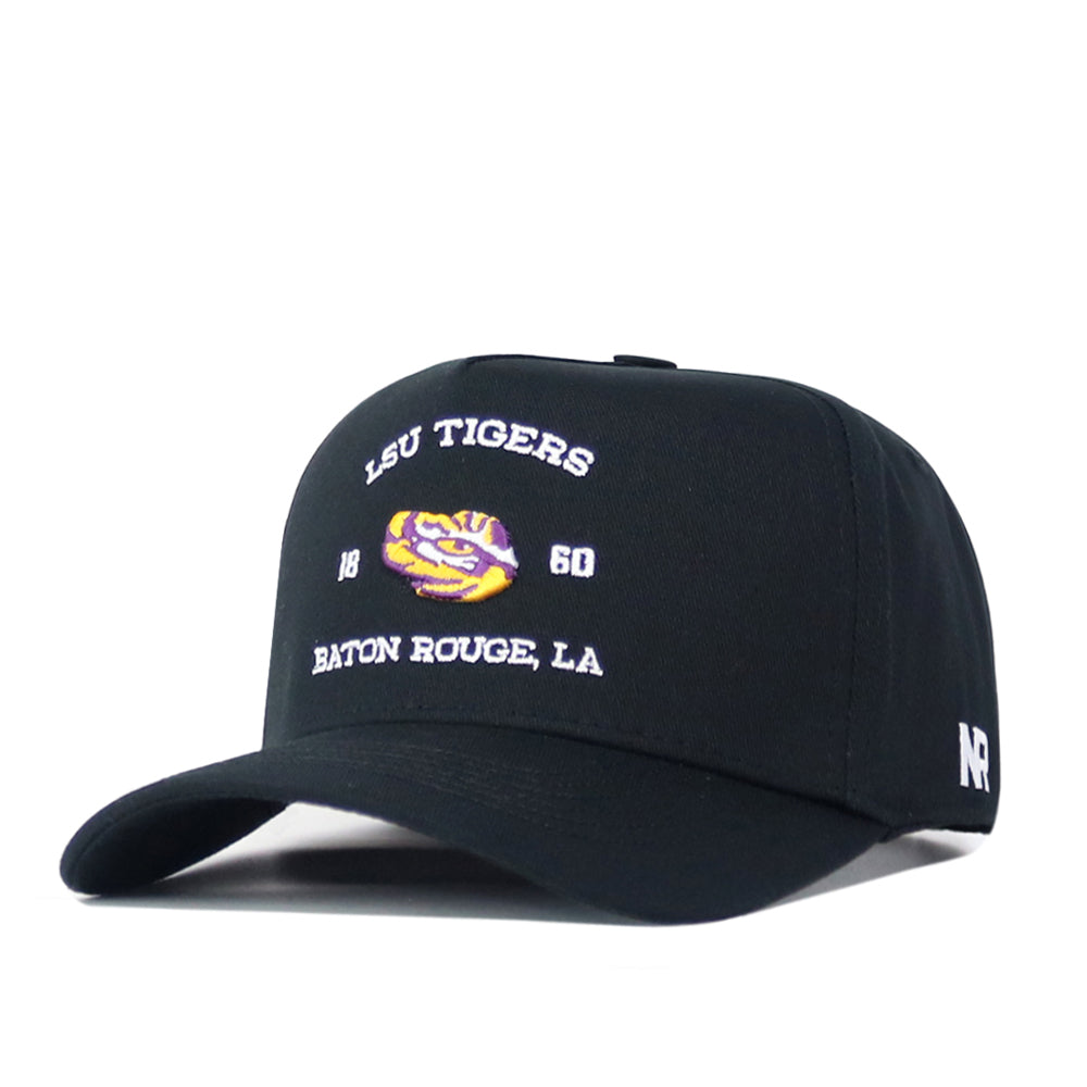 Introducing the LSU Outlaw Hat - Black by No Rivals: This snapback baseball cap features a striking embroidered tiger logo, “1860,” and “Baton Rouge, LA” in bold white and purple on the front. The iconic NR letters are stitched in white on the side—making it the perfect finishing touch for your next Gameday fit.