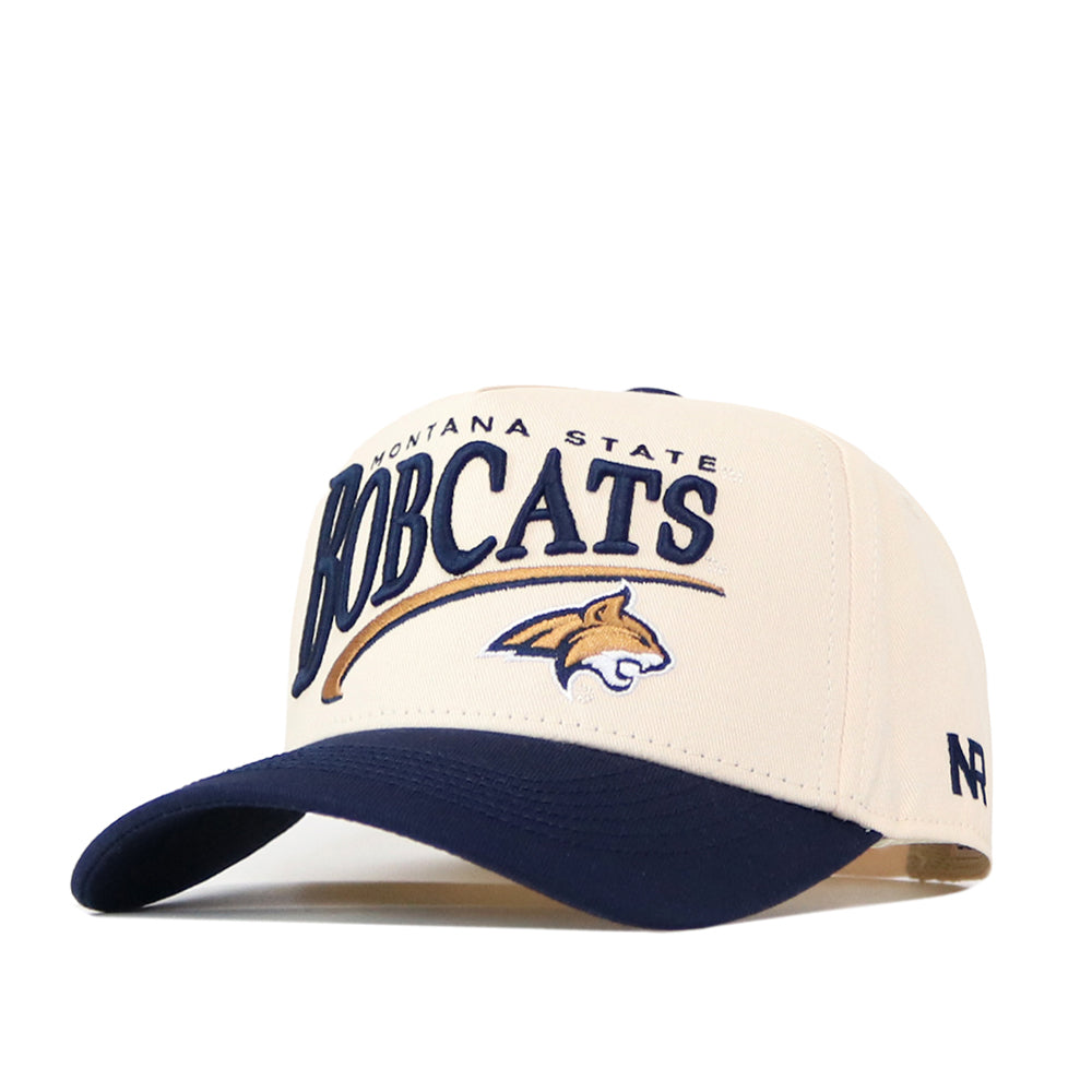 The No Rivals Montana State Bobcats Stride Hat is a beige and navy snapback featuring “Montana State Bobcats” and a bobcat logo embroidered on the front—perfect for completing your gameday look.