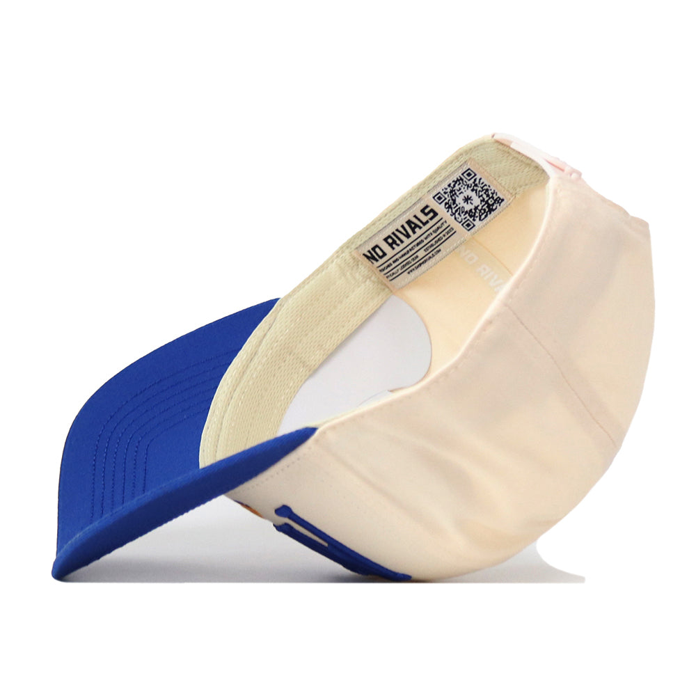 The Pittsburgh Panthers Stride Hat by No Rivals is pictured upside down, displaying the inside label with text and a QR code. The cap features a structured fit with a blue bill, while the visible inner band highlights its high quality cotton construction.
