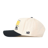 Introducing the Iowa Hawkeyes Stride Hat by No Rivals—a cream-colored, structured fit snapback cap featuring a black brim, sleek black NR initials on the side, and the University of Iowa Hawkeyes logo and text embroidered above the brim. Crafted from high-quality cotton, this hat delivers lasting comfort and unmistakable style.