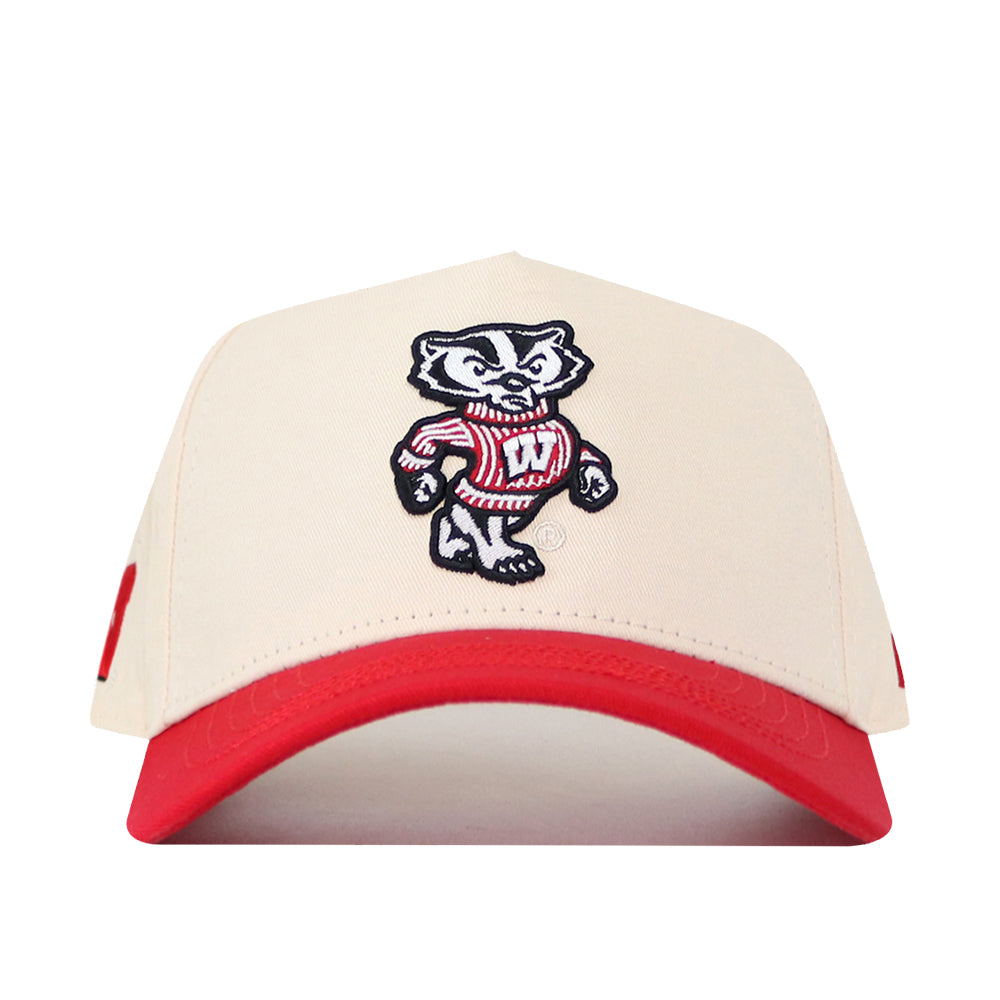 Introducing the Wisconsin Patch Hat by No Rivals—a beige and red snapback cap featuring a high-quality embroidered University of Wisconsin Bucky Badger patch on the front. This officially licensed hat is perfect for true fans who appreciate standout logos and authentic style.