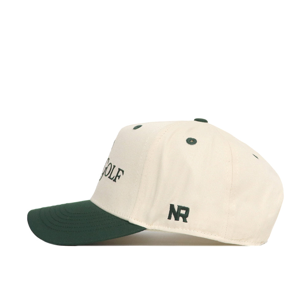 The Play Golf Hat - Classic Green by No Rivals features a cream crown, dark green brim, "NR" embroidered on the side, and "GOLF" partially visible on the front. It includes a classic snapback closure for adjustable comfort.