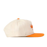 The No Rivals Tennessee Starter Hat is a cream-colored snapback baseball cap featuring an orange brim, an orange button on top, and orange embroidered text on the front, shown here in a side profile view.