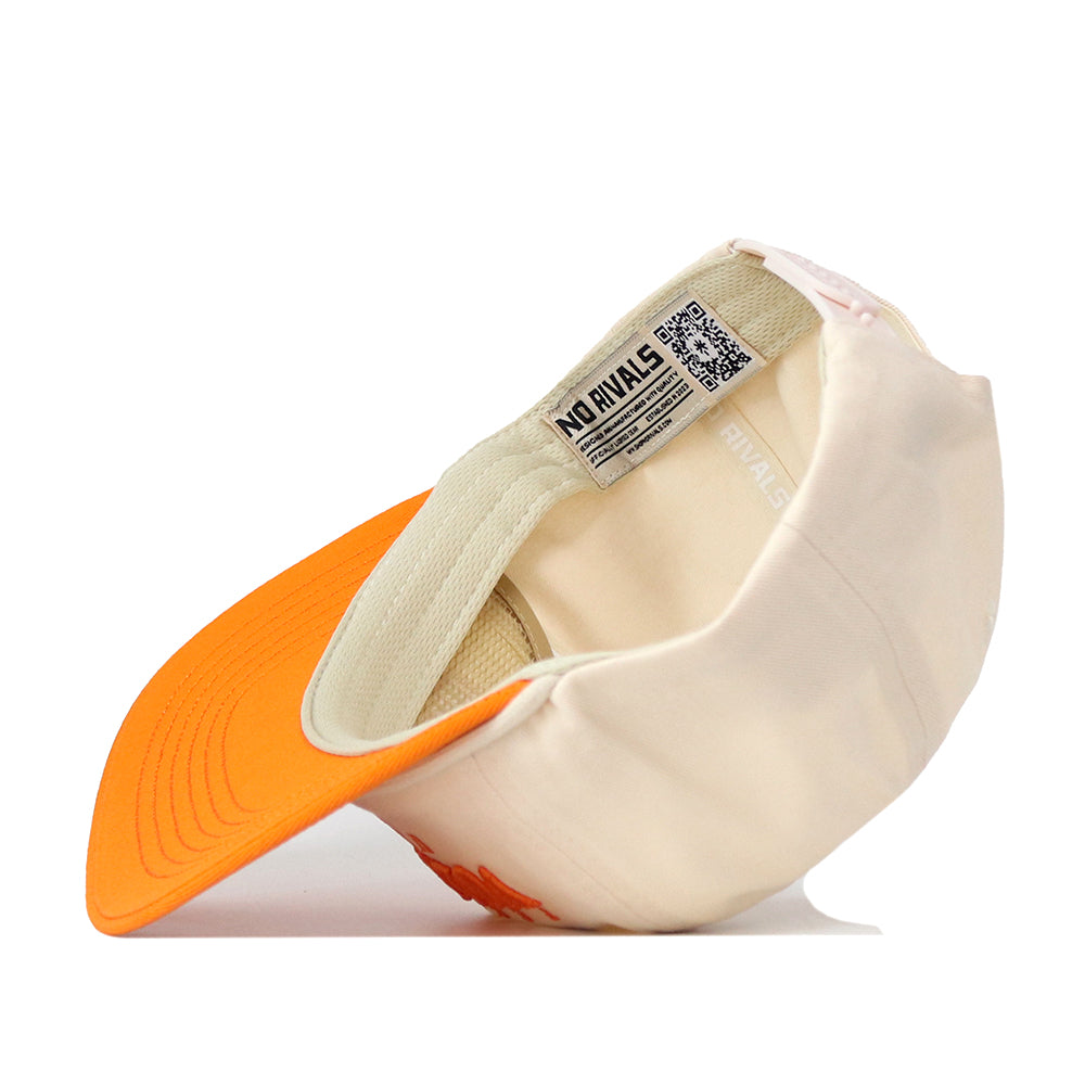 The Tennessee Starter Hat by No Rivals is shown upside down to reveal the inside label with the brand name and the orange underside of the cream-colored brim. This officially licensed snapback cap also features an embroidered logo for a stylish finishing touch.