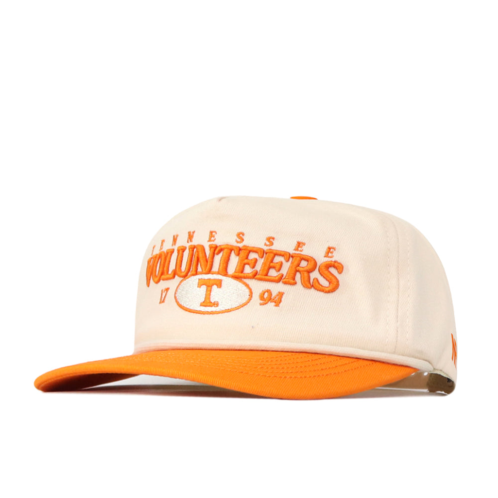 The Tennessee Starter Hat by No Rivals is a cream and orange baseball cap, featuring an officially licensed “Tennessee Volunteers 1794” embroidered logo in orange on the front and an orange brim, with a convenient snap back for an adjustable fit.