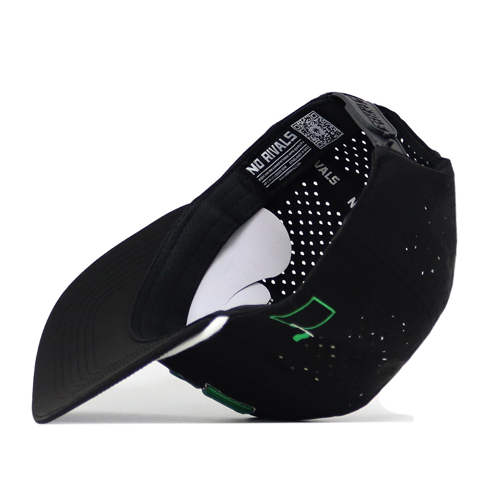 A black North Dakota Golf Hat by No Rivals is pictured flipped upside down, highlighting the inside labels, ventilating perforations, and a green embroidered logo on the front. The snapback adjustment guarantees a comfortable Gameday Fit every time.