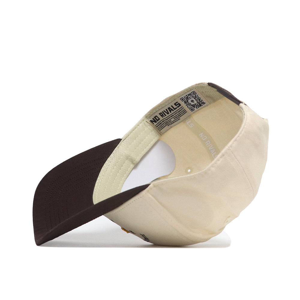 The Iowa State Outlaw Hat - Classic by No Rivals is shown upside down, revealing its interior with a dark brown brim, fabric adjustment strap, officially licensed label with text and QR code, and an embroidered logo for style.