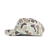 The Oklahoma State Huntsman Hat by No Rivals is a 5-panel snapback in green, beige, and brown duck camo. It features brown embroidered NR letters on the side and is shown with the bill facing left.