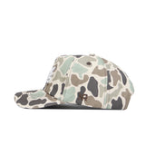 Side view of the No Rivals Nevada Huntsman Hat, a 5-panel duck camo cap in light green, brown, beige, and black. Features white front embroidery, a small brown NR logo on the side, and an adjustable snapback closure.