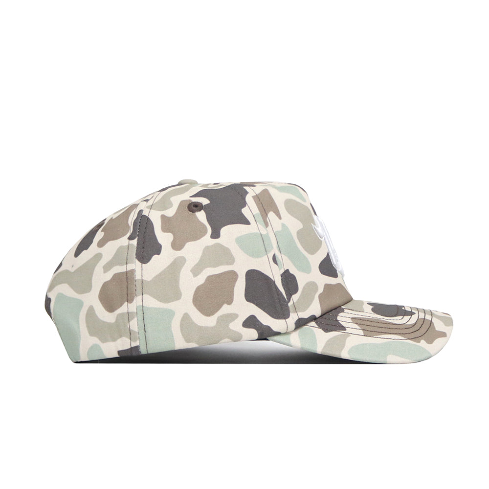 Side view of the No Rivals Nevada Huntsman Hat, a 5-panel duck camo style in green, beige, and brown, with a curved brim, visible bill stitching, and an adjustable snapback closure.