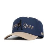 The No Rivals Sunday Golf Hat in navy and tan is a high-quality cotton snapback featuring SUNDAY GOLF and a walking silhouette on the front, a tan visor, and "NFR" stitched in white on the side.