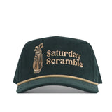 The No Rivals Saturday Scramble Cord Hat - Green features dark green cotton corduroy, beige trim, front embroidery of a golf bag and "Saturday Scramble," and an adjustable snapback closure.