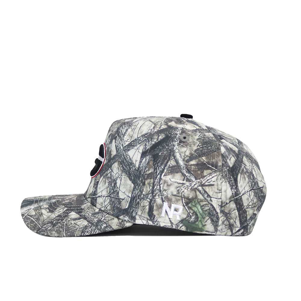 The No Rivals Georgia Outland Hat is a structured snapback with a dark camo pattern, white NP initials embroidered on the back, and crafted from high quality cotton. Side view shown.
