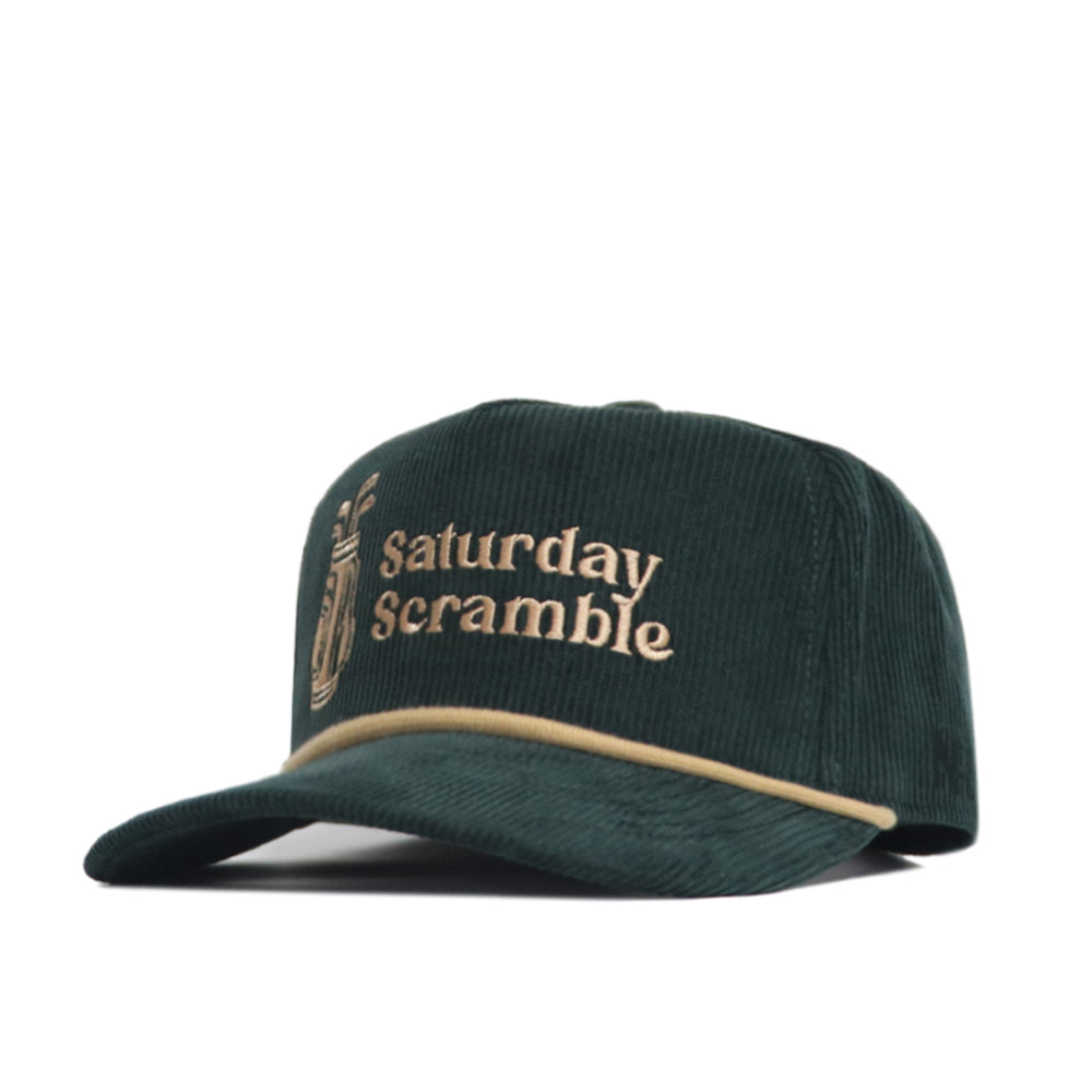 The Saturday Scramble Cord Hat - Green by No Rivals is a dark green cotton corduroy cap with beige "Saturday Scramble" embroidery and a golf club design, beige trim on the brim, and an adjustable snap back for comfort.