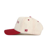 The Washington State Vintage Hat by No Rivals features a cream snapback design with a red brim, button, and stitching, plus an NR embroidered logo on the side. The cap appears in side view with partial front text visible.