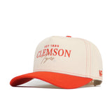 The Clemson Vintage Hat by No Rivals features cream and orange colors, EST 1889 CLEMSON Tigers in orange on the front, NF on the side, a curved orange brim, orange stitching, and an adjustable snapback—perfect for your gameday fit.