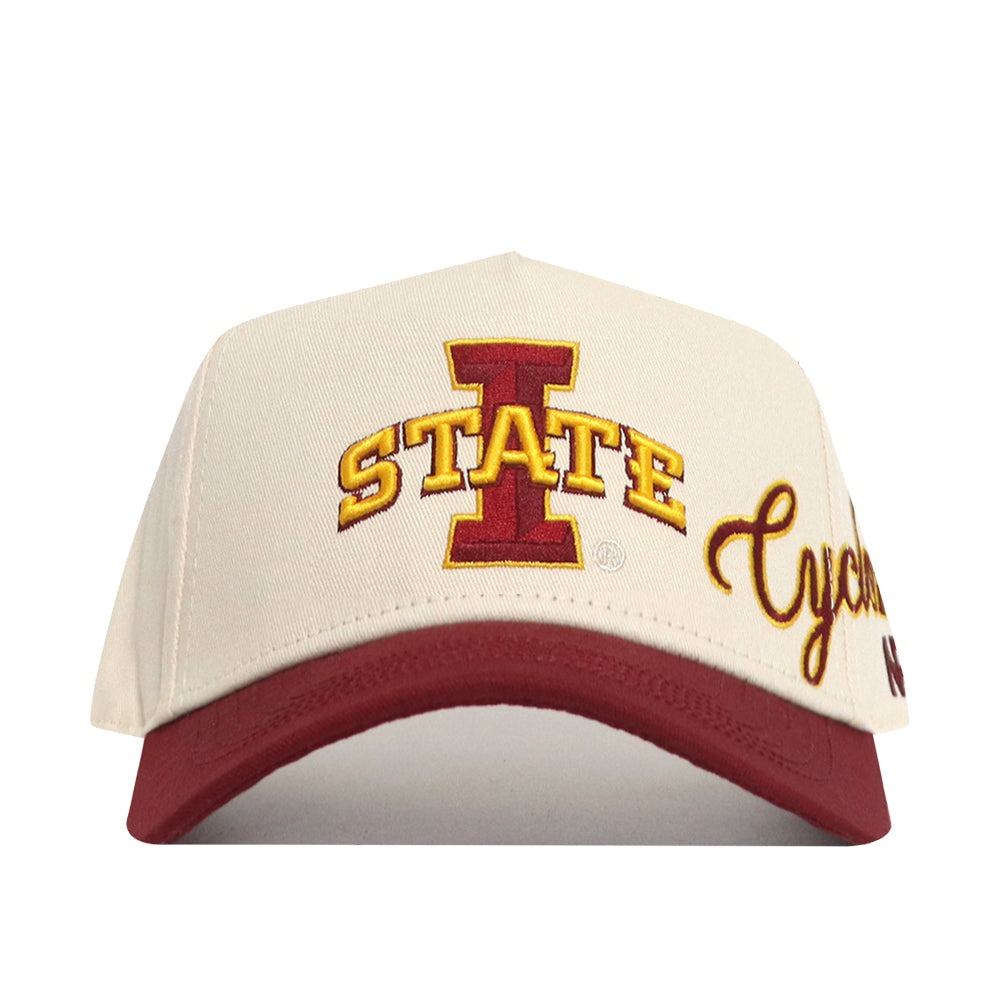 The Iowa State Halftime Hat by No Rivals is a white and red snapback made from premium cotton, featuring a large red "I" with "STATE" in yellow letters and "Cyclones" in yellow script, plus embroidered Iowa State University logos.