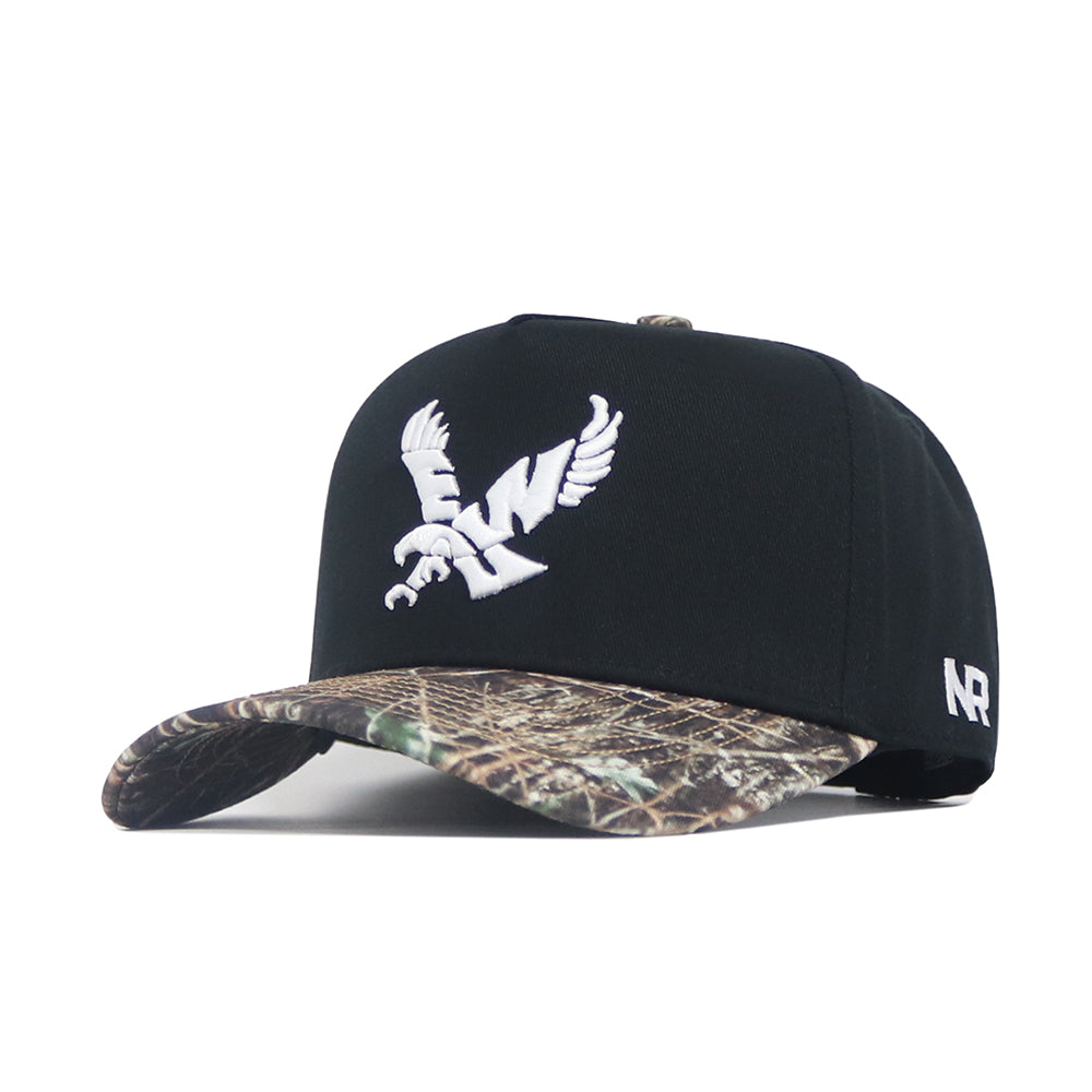 The No Rivals EWU Camo Hat - Trailblazer Edition is a structured fit snapback featuring a black crown, camo-patterned brim, white embroidered bird logo on the front, and NR initials on the side.