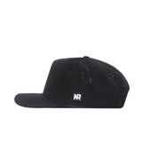 The No Rivals Texas State Golf Hat - Black is shown in profile. It features a flat brim, side ventilation holes, and a rectangular patch with white "NR" embroidery near the brim.