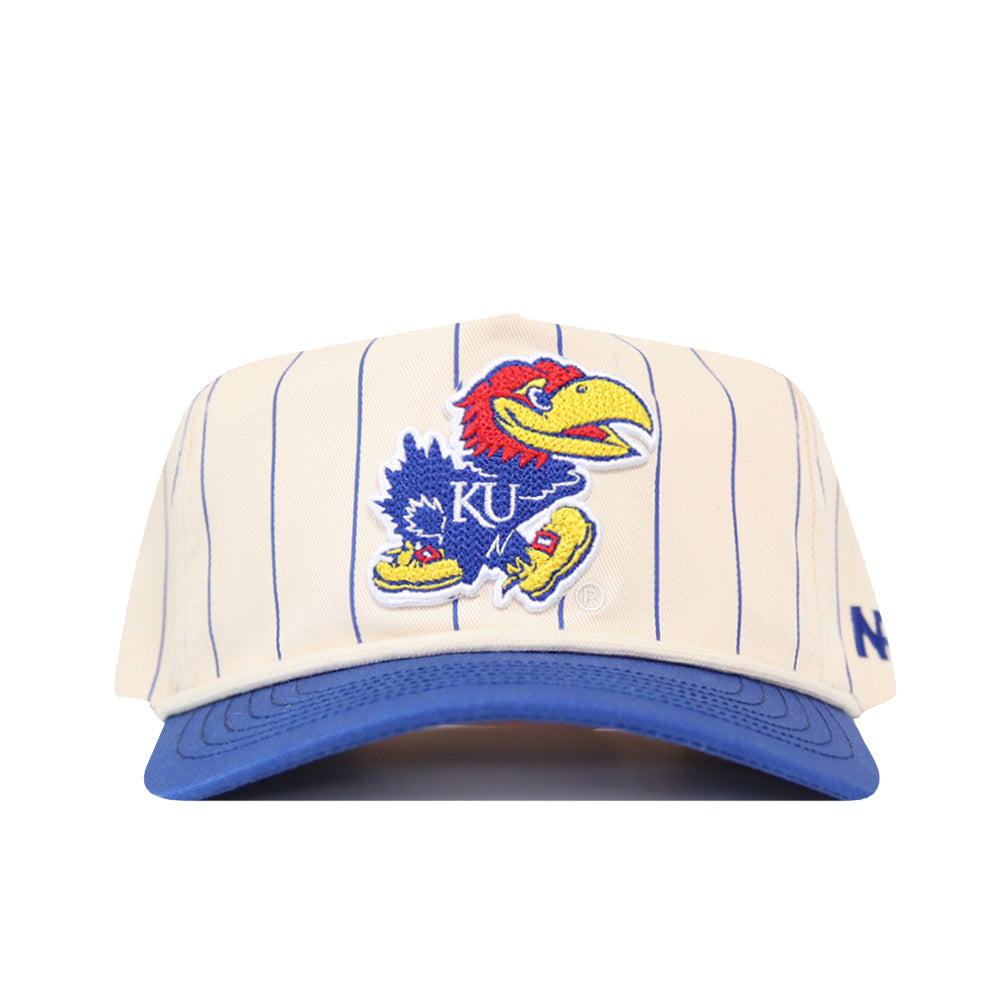 The No Rivals Kansas Pinstripe Hat features a cream base with blue pinstripes, a blue brim, and an embroidered Jayhawk mascot with KU lettering on the front. A blue N logo appears on the left side.