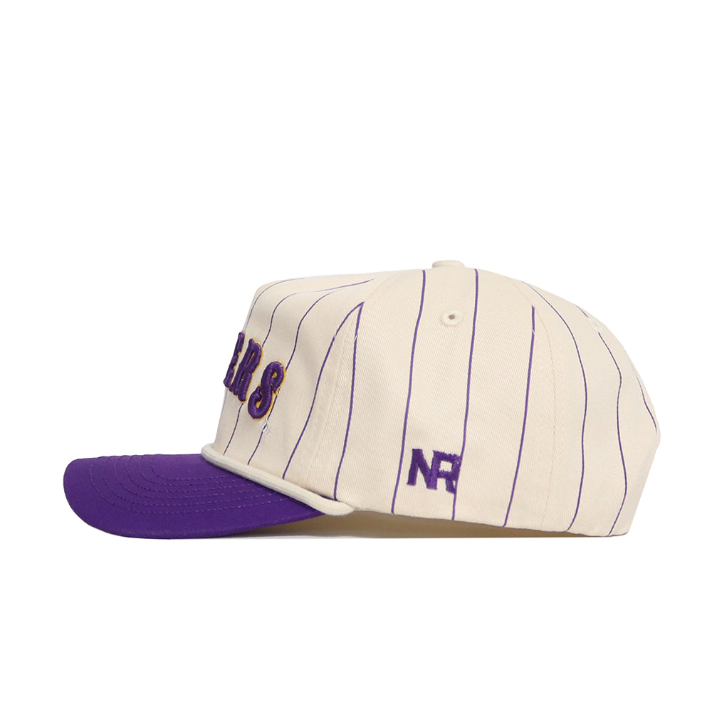 The No Rivals LSU Walk Off Hat features cream cotton fabric with thin purple pinstripes, a purple brim, and purple NR embroidery on the side. This unstructured cap is shown in a side profile on a white background.